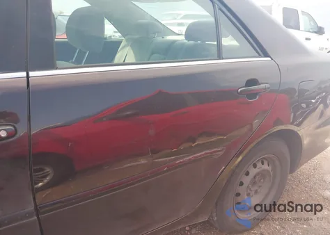 2002 Toyota Camry Le z USA, uszkodzony, nr VIN JTDBE32K720119418